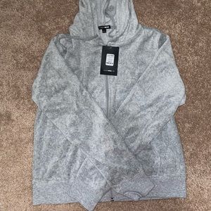 Fashion Nova sweatpants and zip up jacket set.